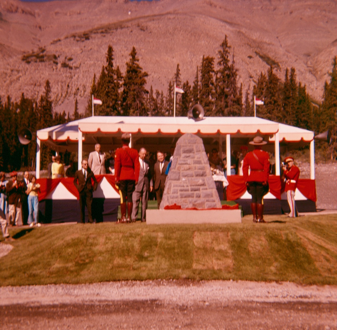 In 1961, RCMP officers helped Parks Canada's unveiling of a cairn, marking the official re-opening of the Icefields Parkway. // JYMA PA19-8